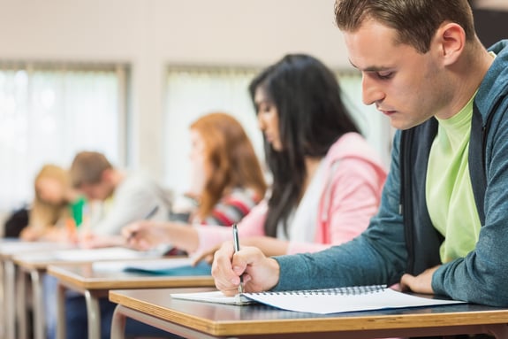 Students taking down notes