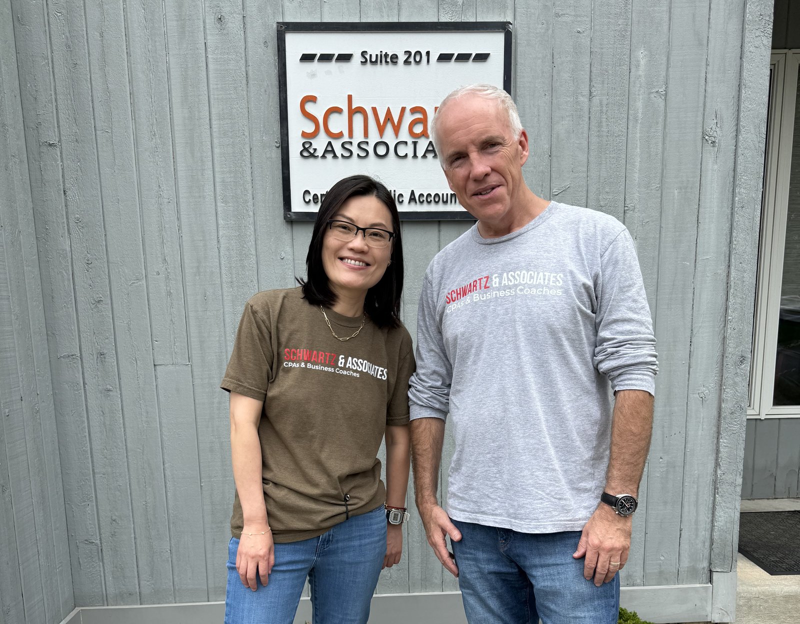 Rich Schwartz and Ling Ji outside the Schwartz & Associates office in Turnersville, NJ